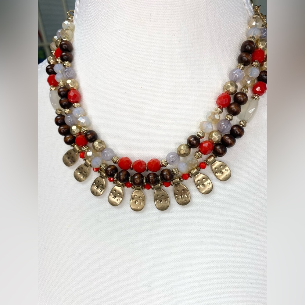 Elara glass and wood bead necklace with gold detail three strand on gold chain